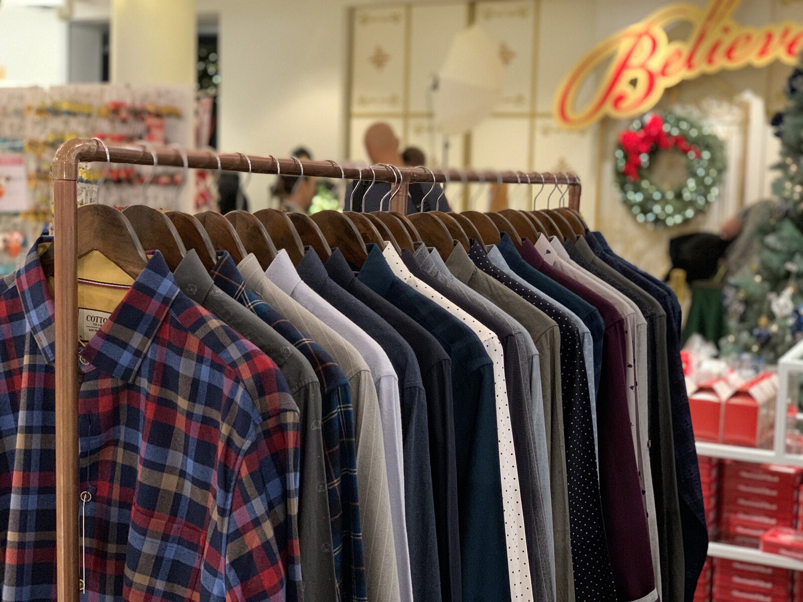 Cotton the First shirt rack at Macy's — full collection on display during holiday season